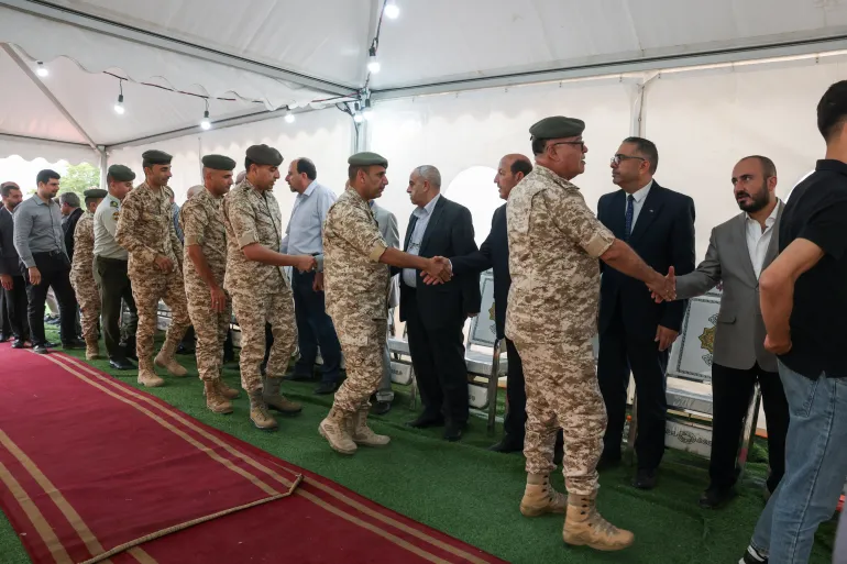 Members of Jordan's military offer condolences on October 26 for the victims of a deadly church shooting in the village of Hamoud in the Karak governorate [Alaa Al Sukhni/Reuters]