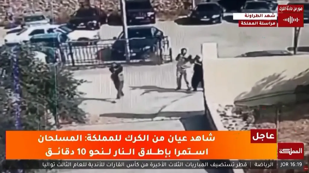 This screen grab taken from CCTV footage aired by Jordan’s state broadcaster Al-Mamlaka shows gunmen attacking a Greek Orthodox church on Oct. 23.